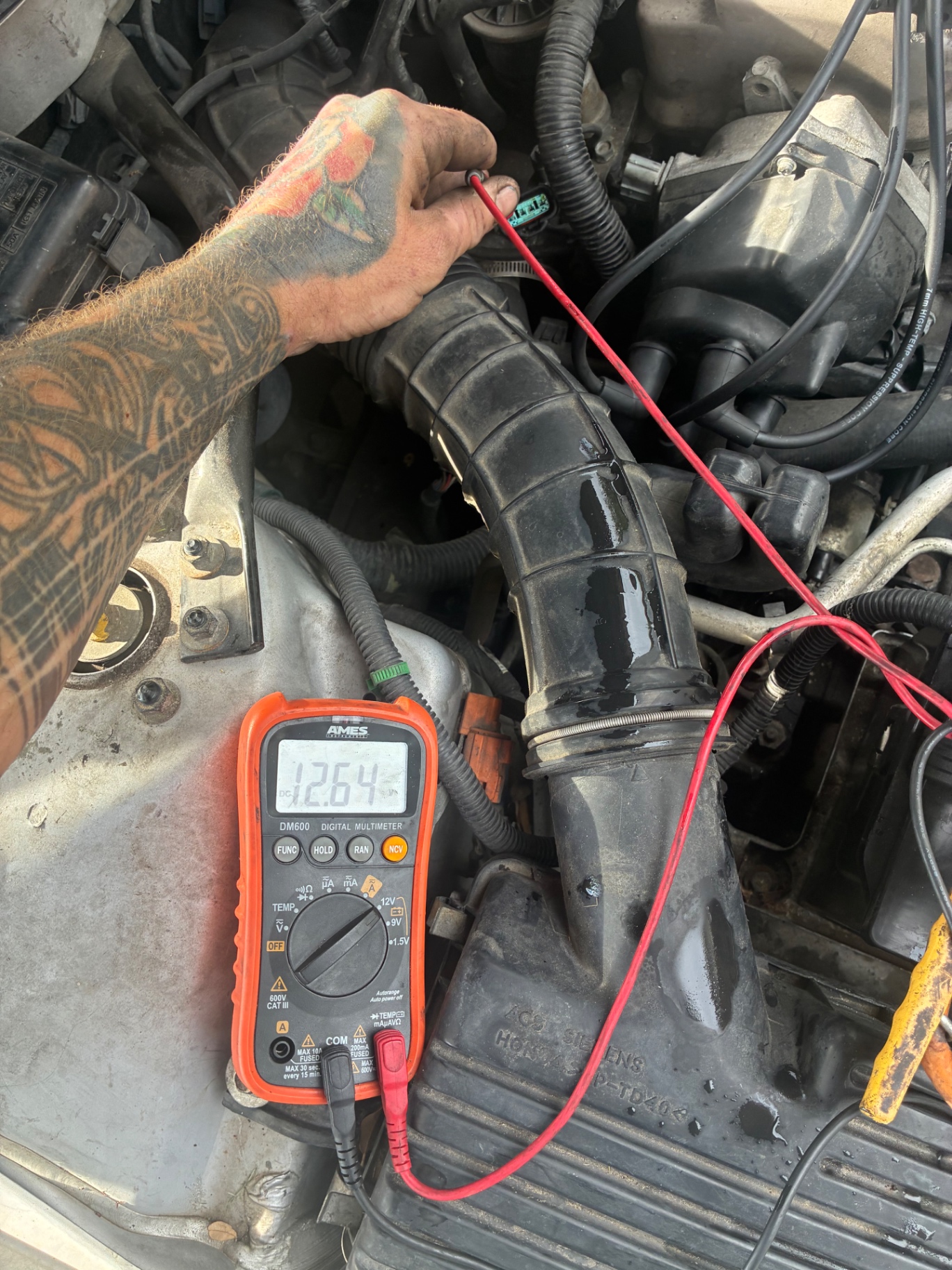 Electrical diagnostics with a multimeter reading 12.64 volts